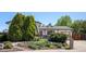 Charming home featuring a well-maintained yard with mature trees and beautiful landscaping at 11279 E Alaska Pl, Aurora, CO 80012