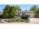 Charming home featuring a well-maintained yard with mature trees and beautiful landscaping at 11279 E Alaska Pl, Aurora, CO 80012