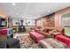 Spacious living room with a fireplace, comfortable seating, and a colorful rug at 11279 E Alaska Pl, Aurora, CO 80012