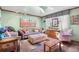 Bright living room with skylights, comfortable seating, and colorful decor at 11279 E Alaska Pl, Aurora, CO 80012
