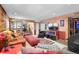 Open-concept living room featuring a fireplace, tv, and ample seating, perfect for entertaining guests at 11279 E Alaska Pl, Aurora, CO 80012