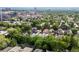 A view of the tree-filled city with many buildings interspersed with nature at 425 Steele St, Denver, CO 80206
