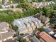 Aerial view of complex with multiple garages, grey roof, and yellow exteriors, surrounded by neighborhood at 425 Steele St, Denver, CO 80206