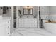 Beautiful bathroom features a tub, shower, and vanity with marble floors at 425 Steele St, Denver, CO 80206