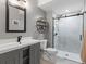 This bathroom features a modern vanity, toilet, and a glass-enclosed shower with stylish tile and fixtures at 425 Steele St, Denver, CO 80206