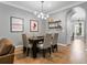 Modern dining room features a dark table with seating for six and hardwood floors at 425 Steele St, Denver, CO 80206