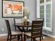 Dining room with round table, gray walls, and bright natural light at 425 Steele St, Denver, CO 80206