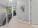 Hallway with art, overhead lighting, and open doorways to other rooms at 425 Steele St, Denver, CO 80206