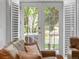 Living room with French doors that lead to a balcony, hardwood floors, and natural light at 425 Steele St, Denver, CO 80206