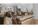 Bright living room features hardwood floors, sofas, staircase with metal railing, and natural lighting at 425 Steele St, Denver, CO 80206