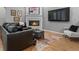 Inviting living room features fireplace, hardwood floors, and comfortable seating at 425 Steele St, Denver, CO 80206
