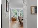 Arched doorway leads into living room with hardwood floors and French doors at 425 Steele St, Denver, CO 80206