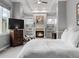 Main bedroom features a fireplace, sitting area, neutral colors, and many windows at 425 Steele St, Denver, CO 80206