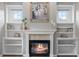 Fireplace in the main bedroom with surrounding shelves and painting above at 425 Steele St, Denver, CO 80206