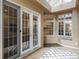 Inviting sunroom with skylights, multiple windows, neutral colors, and sliding glass doors at 425 Steele St, Denver, CO 80206