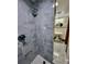 Marble shower with rainfall showerhead, open to pedestal sink bathroom at 1034 N Logan St # 2W, Denver, CO 80203