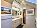 Bathroom featuring double vanity, framed art, and mosaic tile flooring at 1034 N Logan St # 2W, Denver, CO 80203