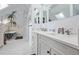 A luxurious bathroom featuring dual sinks and a soaking tub at 1034 N Logan St # 2W, Denver, CO 80203