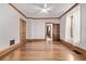 Bright bedroom features hardwood floors, detailed trim, neutral walls, and two closets at 1034 N Logan St # 2W, Denver, CO 80203