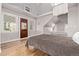 A cozy bedroom with a bed and many windows is showcased at 1034 N Logan St # 2W, Denver, CO 80203