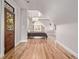 Spacious bedroom featuring wood floors and a stylish door at 1034 N Logan St # 2W, Denver, CO 80203