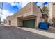Garage in the alley featuring green garage door at 1034 N Logan St # 2W, Denver, CO 80203