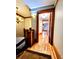 Elegant hallway featuring hardwood floors, decorative lighting, and classic trim details at 1034 N Logan St # 2W, Denver, CO 80203
