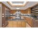Gourmet kitchen featuring stainless steel appliances, a spacious island, and custom cabinetry at 1034 N Logan St # 2W, Denver, CO 80203