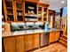 Charming kitchen with stainless steel appliances, tile backsplash, and beautiful wood cabinetry at 1034 N Logan St # 2W, Denver, CO 80203