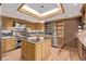 Gourmet kitchen featuring stainless steel appliances, a spacious island, and custom cabinetry at 1034 N Logan St # 2W, Denver, CO 80203