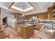 Well-equipped kitchen featuring an island, stainless steel appliances, and custom cabinetry at 1034 N Logan St # 2W, Denver, CO 80203