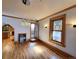 Inviting living room with hardwood floors, a fireplace, stained glass windows, and modern light fixtures at 1034 N Logan St # 2W, Denver, CO 80203
