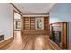 Spacious living area boasting hardwood floors, custom built-ins, and a fireplace at 1034 N Logan St # 2W, Denver, CO 80203