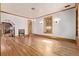 Well-lit living room featuring hardwood floors, bar area, and decorative window at 1034 N Logan St # 2W, Denver, CO 80203