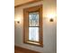 Stained-glass window with symmetrical, ornate lighting on either side of a wall at 1034 N Logan St # 2W, Denver, CO 80203