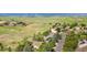 Aerial view of a neighborhood with tree-lined streets and green spaces at 5090 Golden Valley Trl, Castle Rock, CO 80109