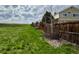Spacious backyard featuring lawn and wood fence at 5090 Golden Valley Trl, Castle Rock, CO 80109