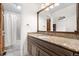 Well-lit bathroom with granite countertop, vanity, and a shower-tub combo at 5090 Golden Valley Trl, Castle Rock, CO 80109