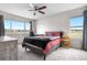 Bedroom with large windows offering natural light and views, complemented by simple decor at 5090 Golden Valley Trl, Castle Rock, CO 80109