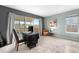 Bright bedroom featuring an office area with a large window and neutral-toned decor at 5090 Golden Valley Trl, Castle Rock, CO 80109