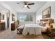 Bright bedroom features a comfortable bed, large window, and stylish furnishings at 5090 Golden Valley Trl, Castle Rock, CO 80109