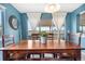 Well-lit dining room with wooden table and large windows offering great outdoor view at 5090 Golden Valley Trl, Castle Rock, CO 80109