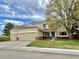 Charming two-story home with a three-car garage, inviting front porch, and well-maintained lawn at 5090 Golden Valley Trl, Castle Rock, CO 80109