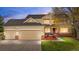 Beautiful two-story home featuring a well-maintained lawn and a spacious three-car garage at 5090 Golden Valley Trl, Castle Rock, CO 80109