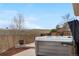 Relaxing backyard featuring a modern hot tub with a privacy fence and picturesque views at 5090 Golden Valley Trl, Castle Rock, CO 80109