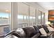 Bright living room showcases expansive windows and comfortable, stylish seating arrangement at 5090 Golden Valley Trl, Castle Rock, CO 80109