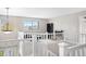 Bright loft with white railing, large windows, and comfortable seating area at 5090 Golden Valley Trl, Castle Rock, CO 80109