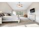 Spacious main bedroom with large window, ceiling fan, and bright natural light at 5090 Golden Valley Trl, Castle Rock, CO 80109