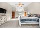 Spacious main bedroom with high ceilings, and ample natural light, complemented by stylish decor at 5090 Golden Valley Trl, Castle Rock, CO 80109