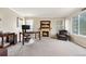 Cozy home office with a stone fireplace, comfortable seating, and natural light from the window at 5090 Golden Valley Trl, Castle Rock, CO 80109